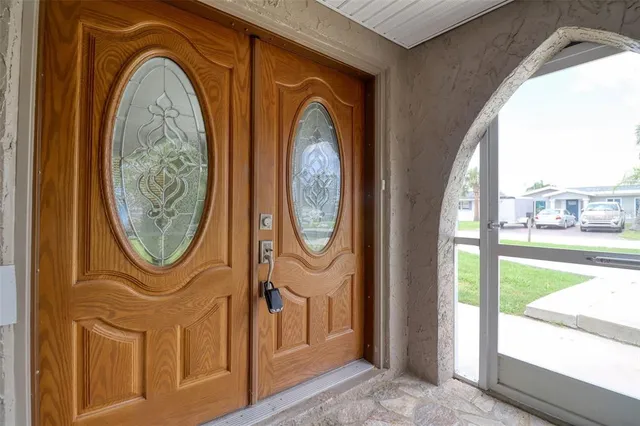 a living room with furniture a rug and a flat screen tv