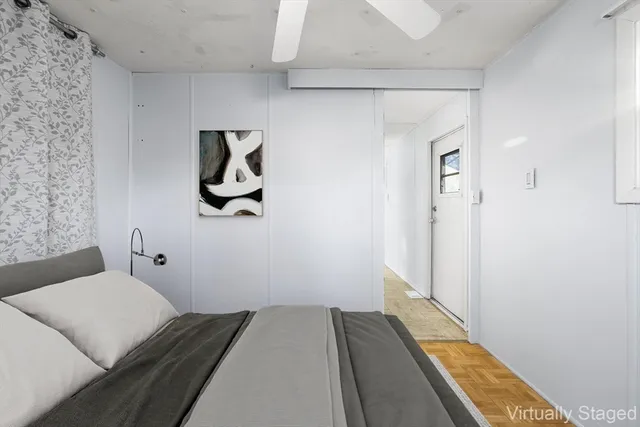 a view of a storage & utility room with closet fan