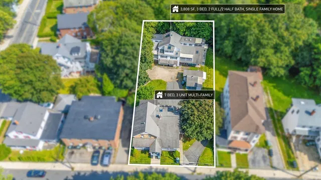 an aerial view of houses with outdoor space