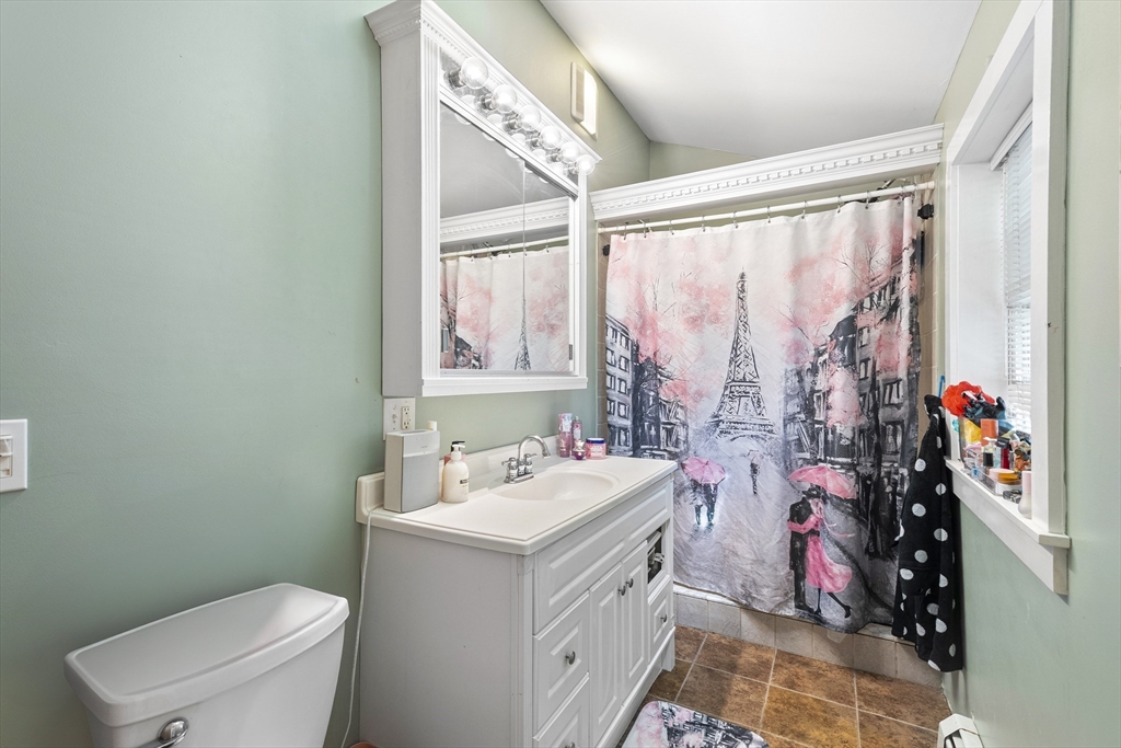 13 Coombs Street Southbridge, MA 01550 - Photo 17 of 41 a bathroom with a sink toilet vanity and window