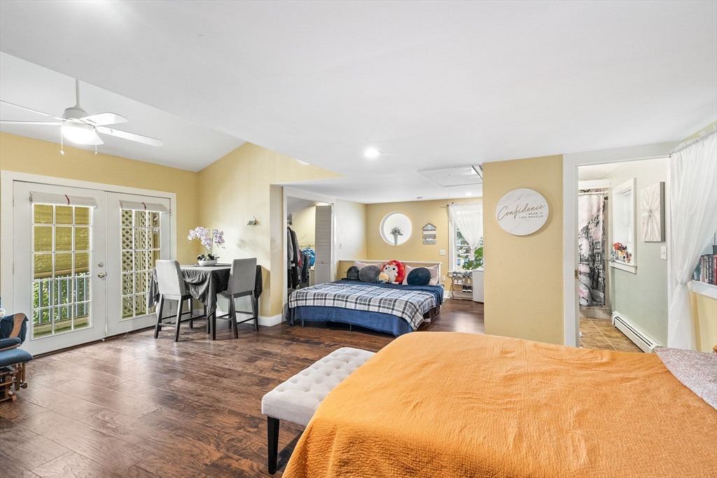 13 Coombs Street Southbridge, MA 01550 - Photo 19 of 41 a bedroom with a bed and wooden floor