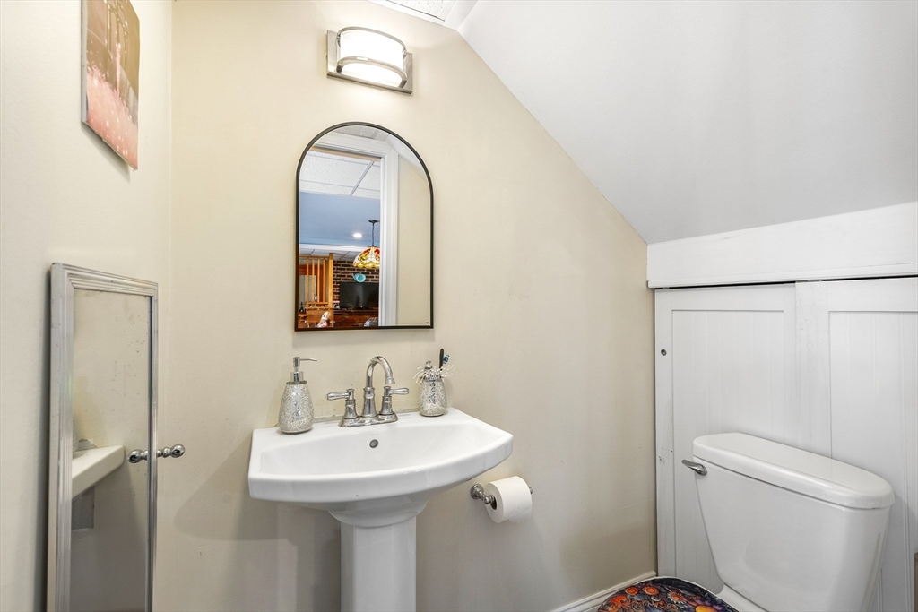 13 Coombs Street Southbridge, MA 01550 - Photo 23 of 41 a bathroom with a sink toilet and a mirror