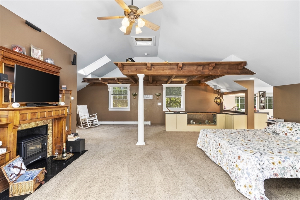 13 Coombs Street Southbridge, MA 01550 - Photo 27 of 41 a view of a livingroom with furniture and a flat screen tv