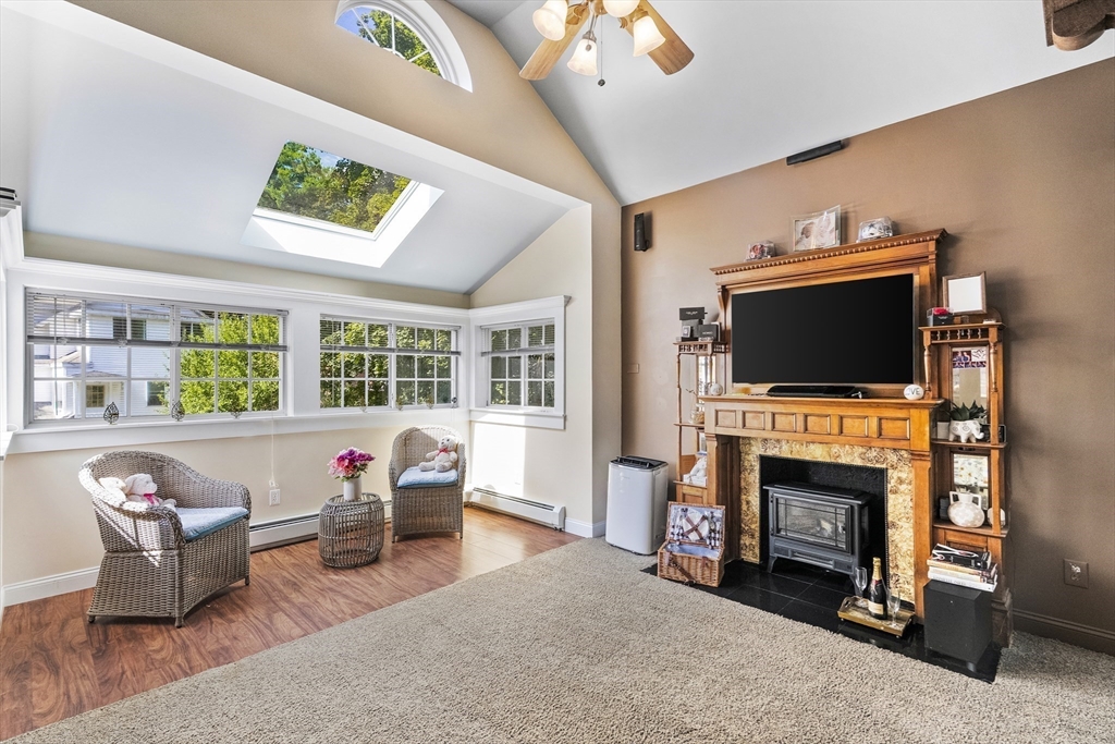 13 Coombs Street Southbridge, MA 01550 - Photo 28 of 41 a living room with furniture fireplace and flat screen tv