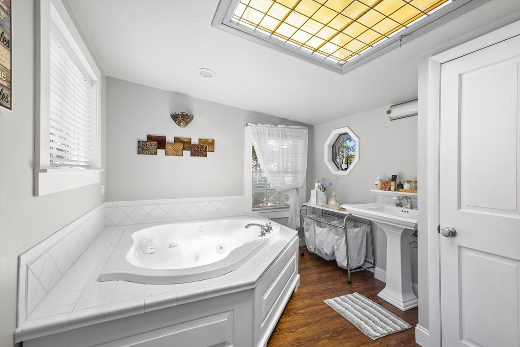 13 Coombs Street Southbridge, MA 01550 - Photo 33 of 41 a bathroom with a sink a bathtub and a window