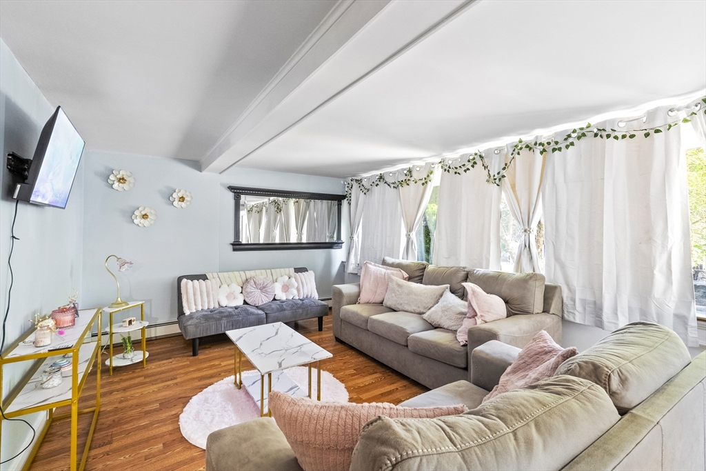 13 Coombs Street Southbridge, MA 01550 - Photo 38 of 41 a living room with furniture and a large window