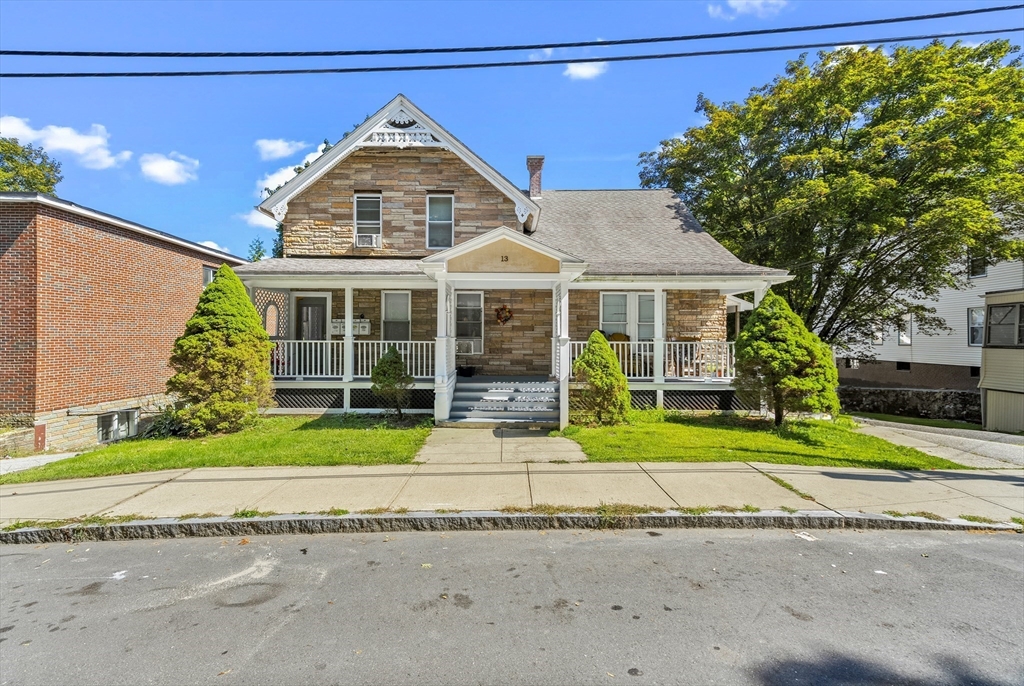 13 Coombs Street Southbridge, MA 01550 - Photo 7 of 41 a front view of a house with a garden and plants