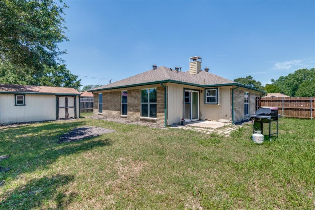 7410 Jessica Way Rowlett, TX 75088 - Photo 25 of 25 a front view of house with yard and green space