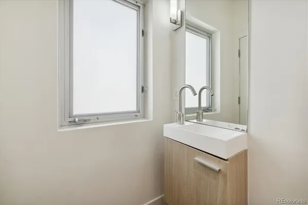 a bathroom with a sink and mirror