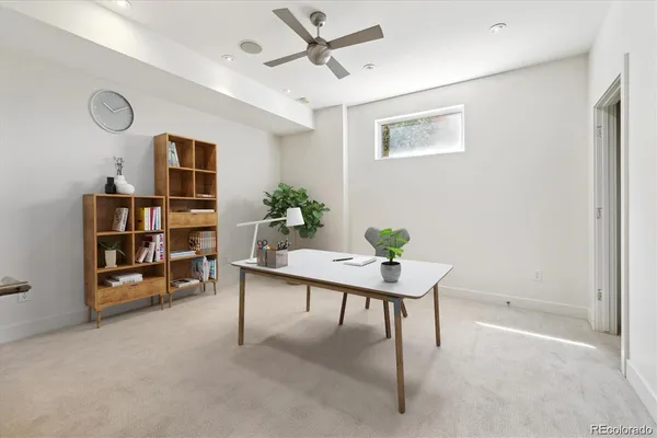 a workspace with furniture and window