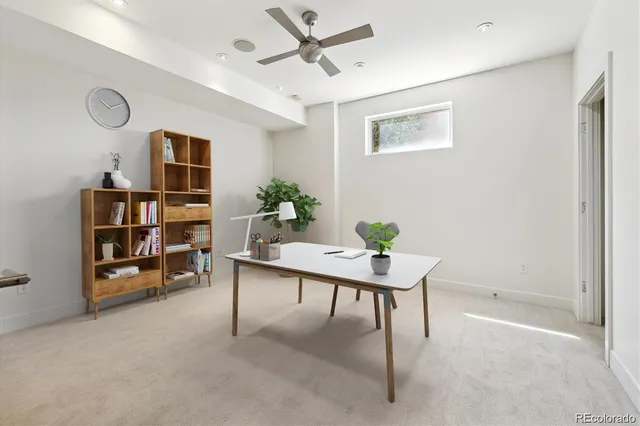 a workspace with furniture and window