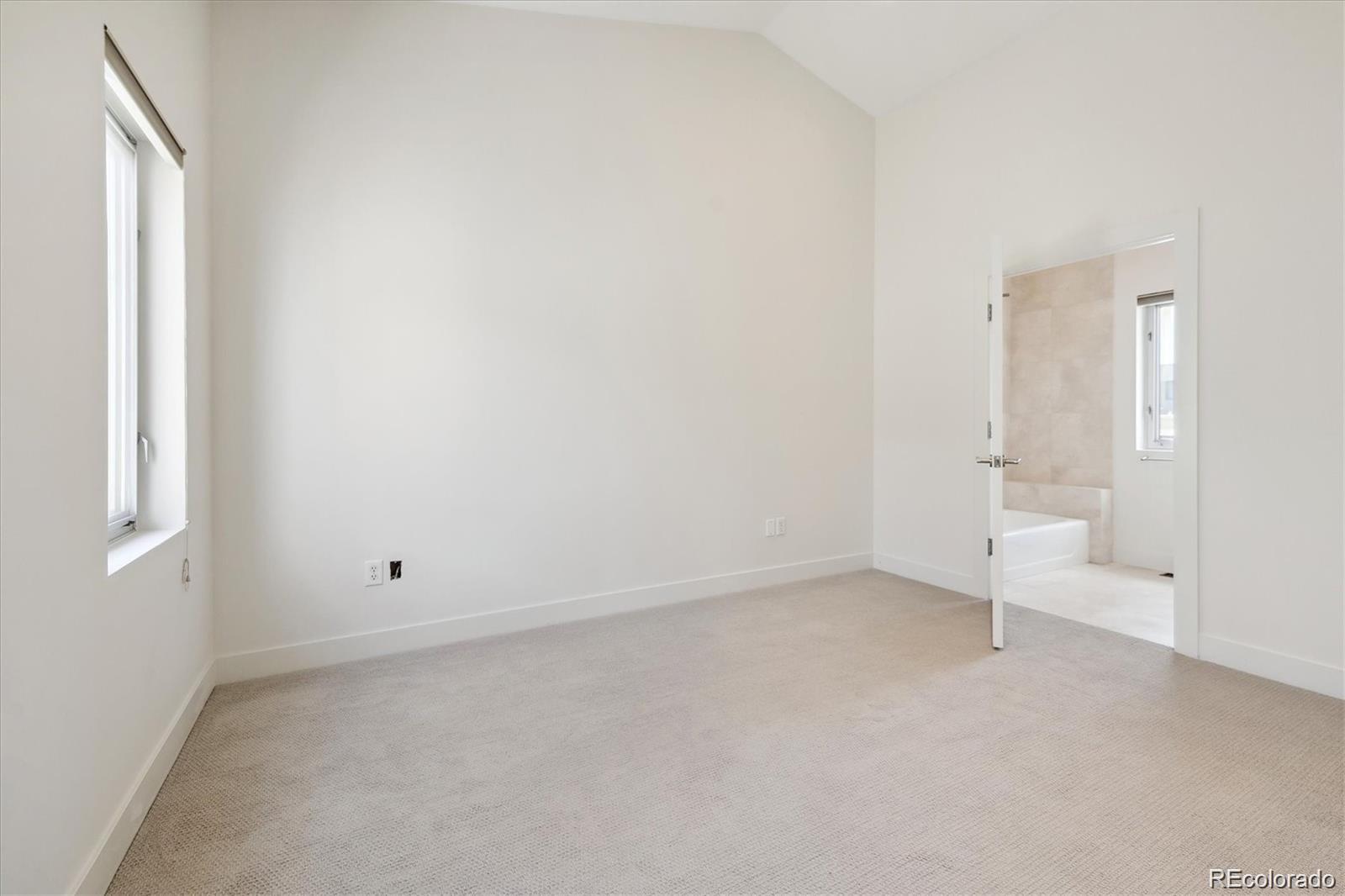 2312 South University Boulevard Denver, CO 80210 - Photo 15 of 23 an empty room with white walls and window