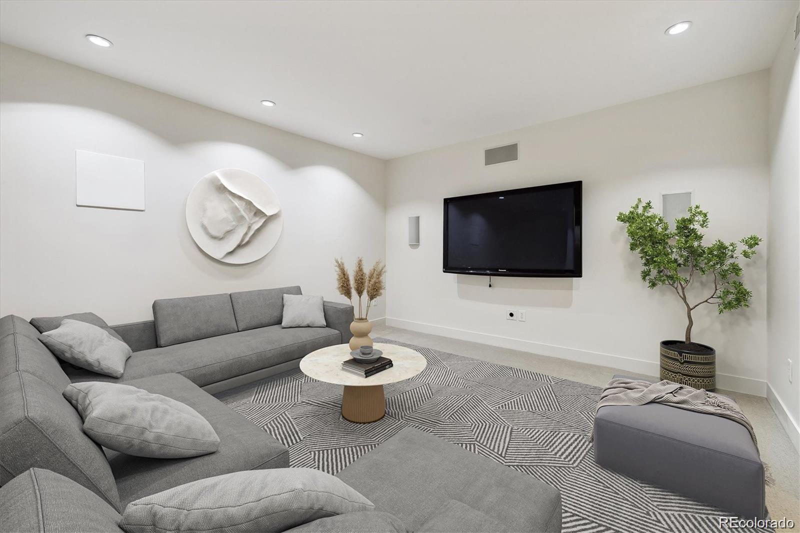 2312 South University Boulevard Denver, CO 80210 - Photo 19 of 23 a living room with furniture and a flat screen tv
