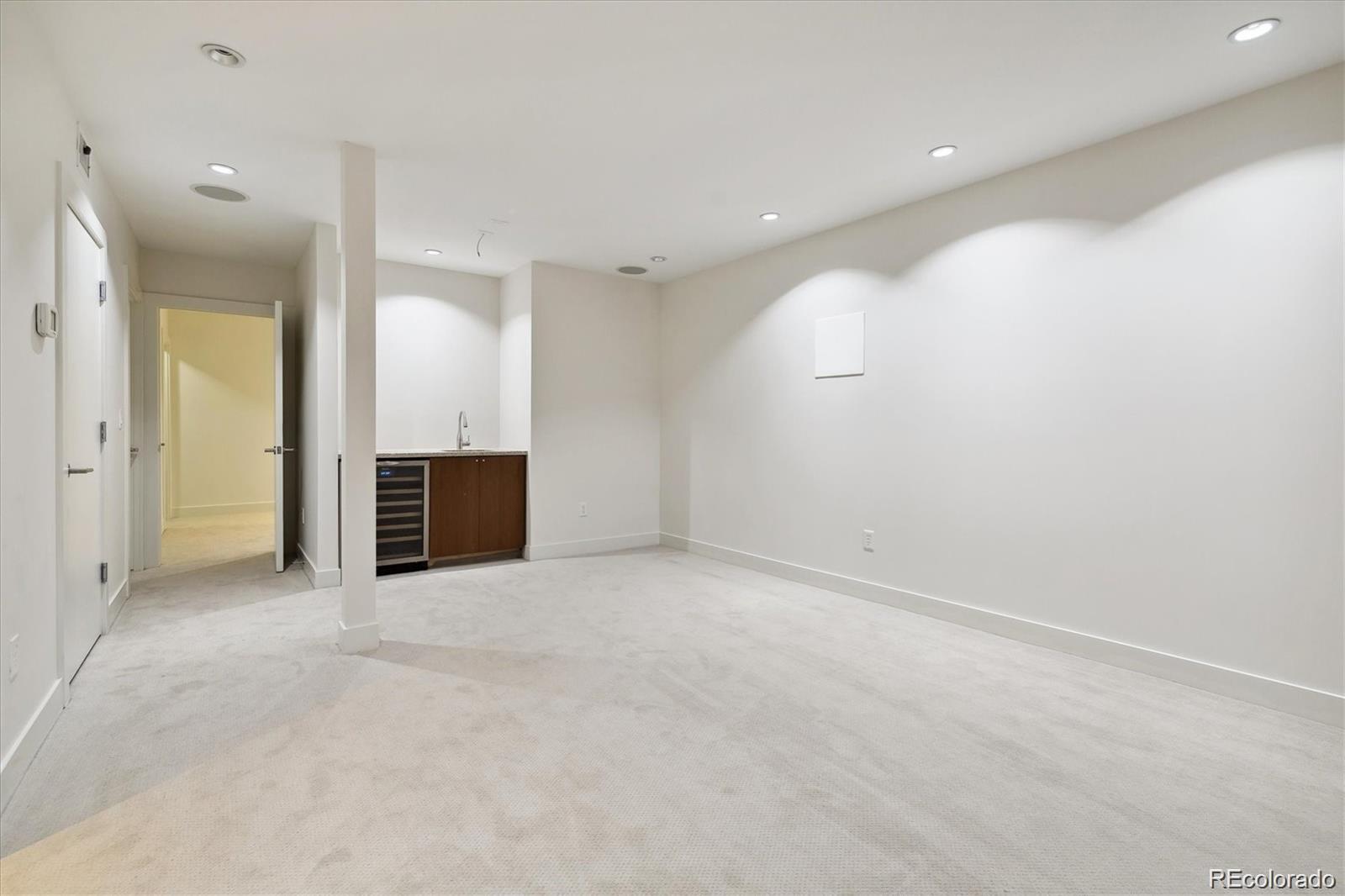 2312 South University Boulevard Denver, CO 80210 - Photo 20 of 23 an empty room with kitchen and sink