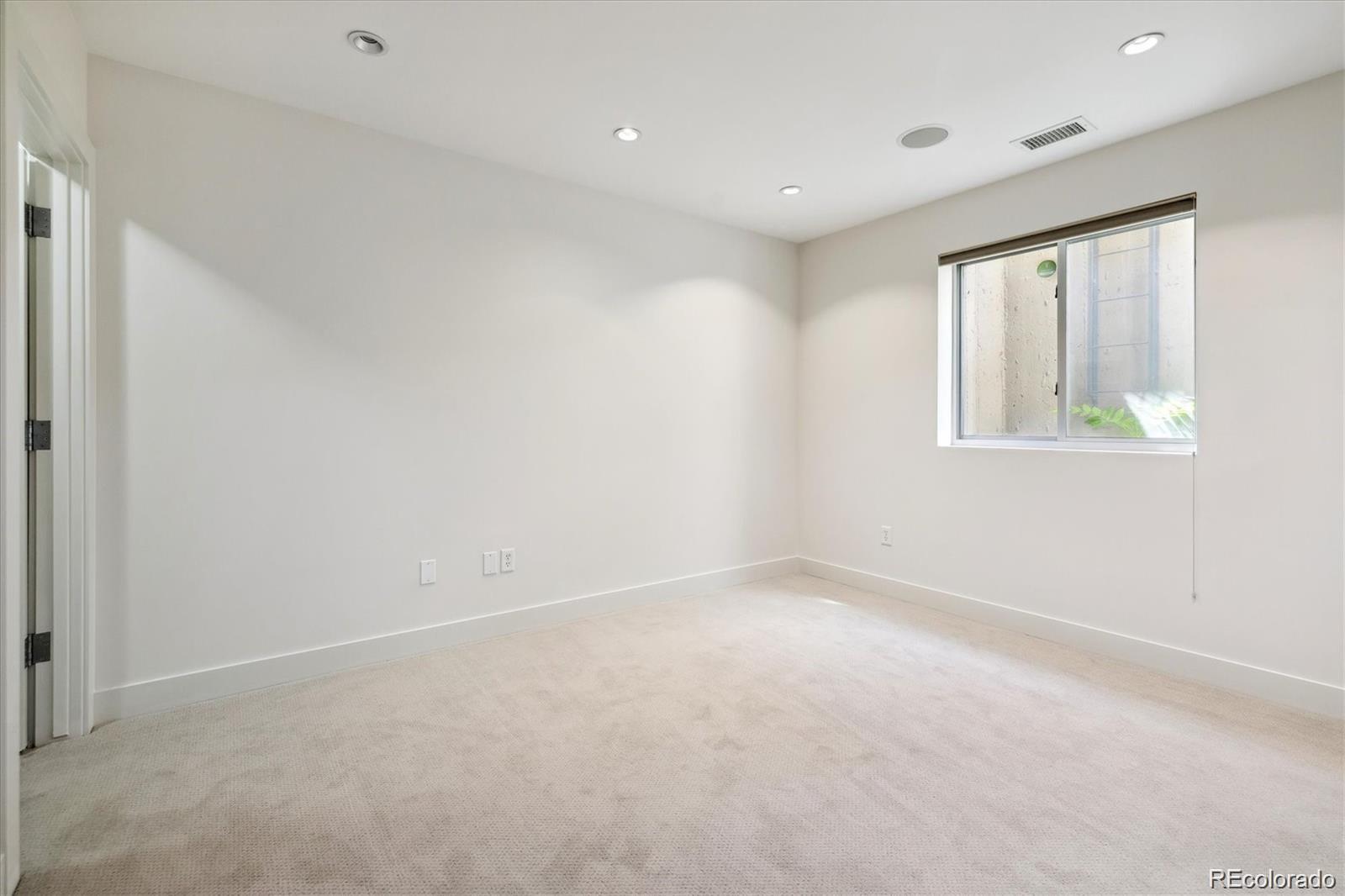 2312 South University Boulevard Denver, CO 80210 - Photo 22 of 23 an empty room with windows