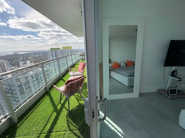 a view of swimming pool from a balcony