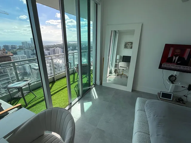 a living room with furniture and a gate