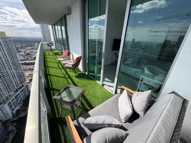 a garden view with a seating space