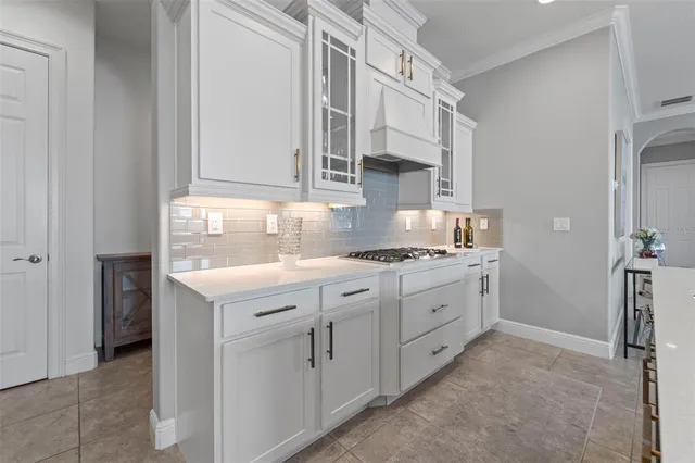 a view of a hallway with wooden floor and entryway