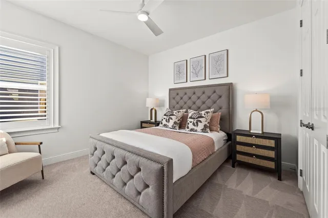 a bedroom with a bed and a table in it