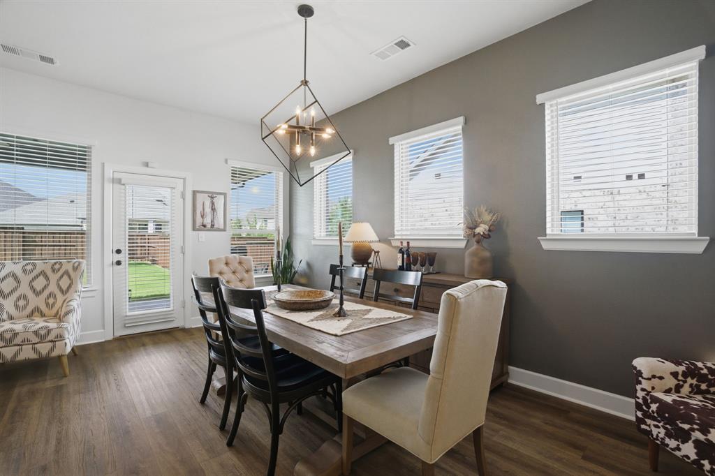 1632 Cotton Road Van Alstyne, TX 75495 - Photo 12 of 40 a view of a dining room with furniture window and wooden floor