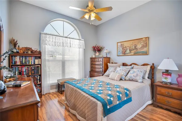 a bedroom with a bed furniture and a window