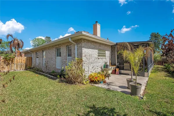 an aerial view of a house with a swimming pool yard and outdoor seating