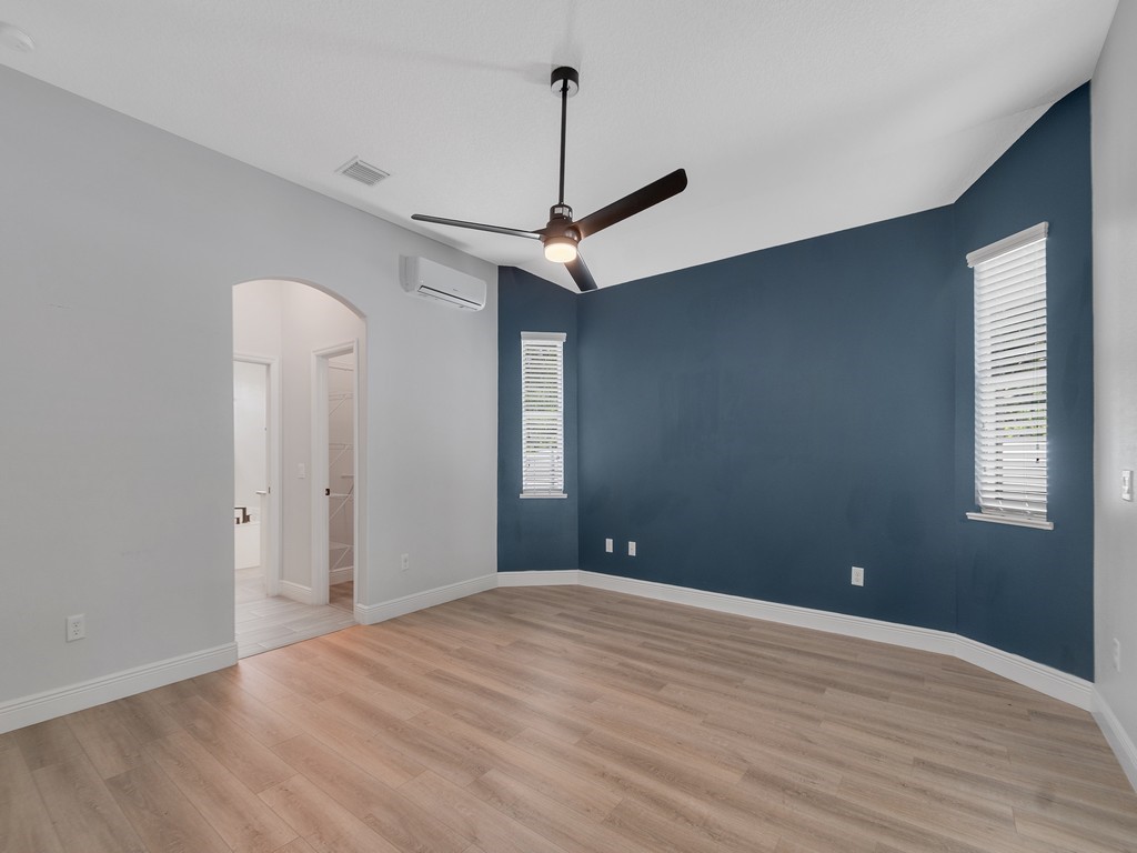 431 Midvale Terrace Sebastian, FL 32958 - Photo 19 of 34 a view of a room with a ceiling fan and hardwood floor