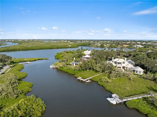 an aerial view of a house with a lake view