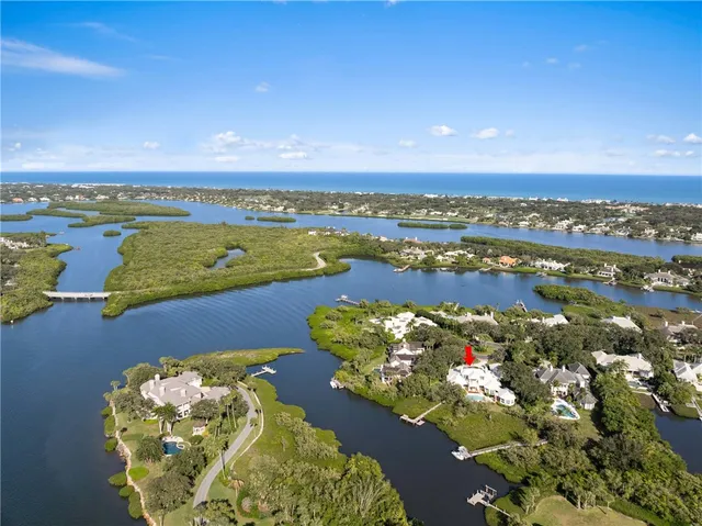 an aerial view of a golf course with an ocean view