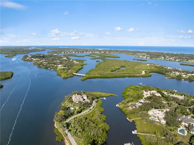 an aerial view of a golf course with an ocean view