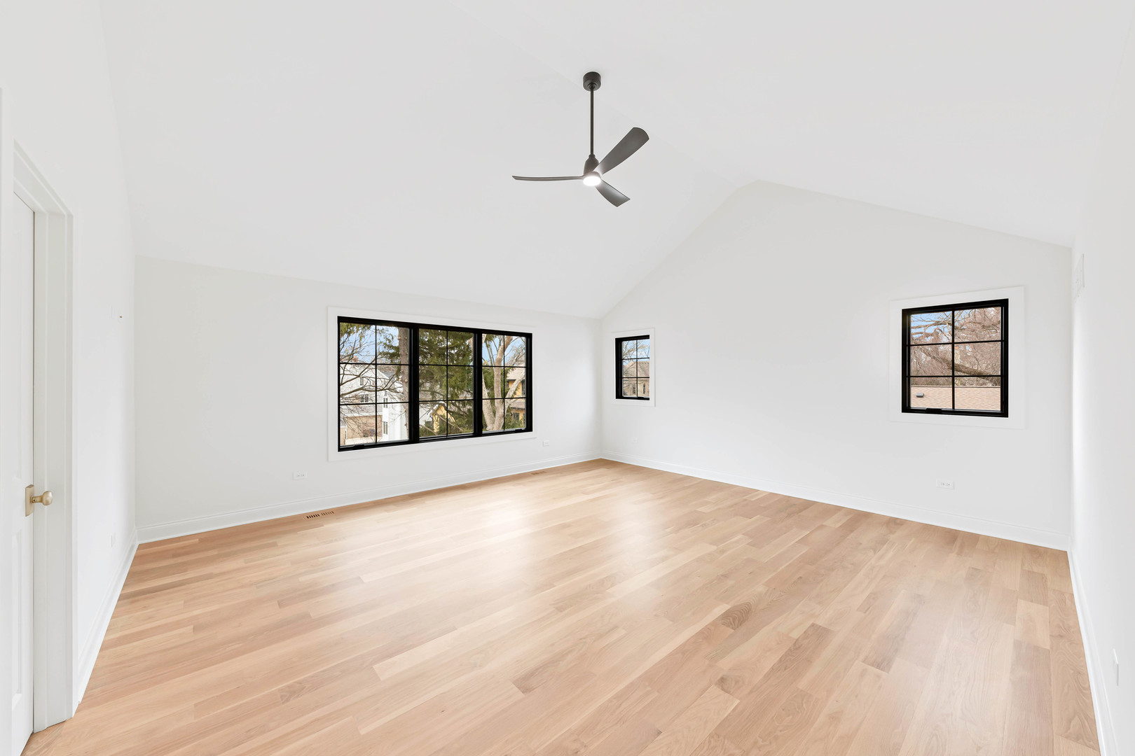 1310 Eagle Street Naperville, IL 60563 - Photo 17 of 38 an empty room with wooden floor ceiling fan and windows
