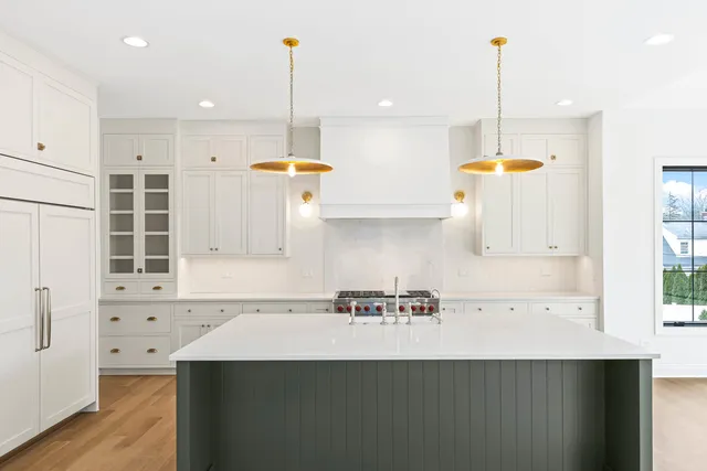 a kitchen with a sink a counter space and a window