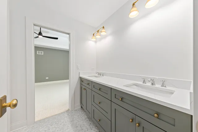 a bathroom with a sink a mirror and a bathtub