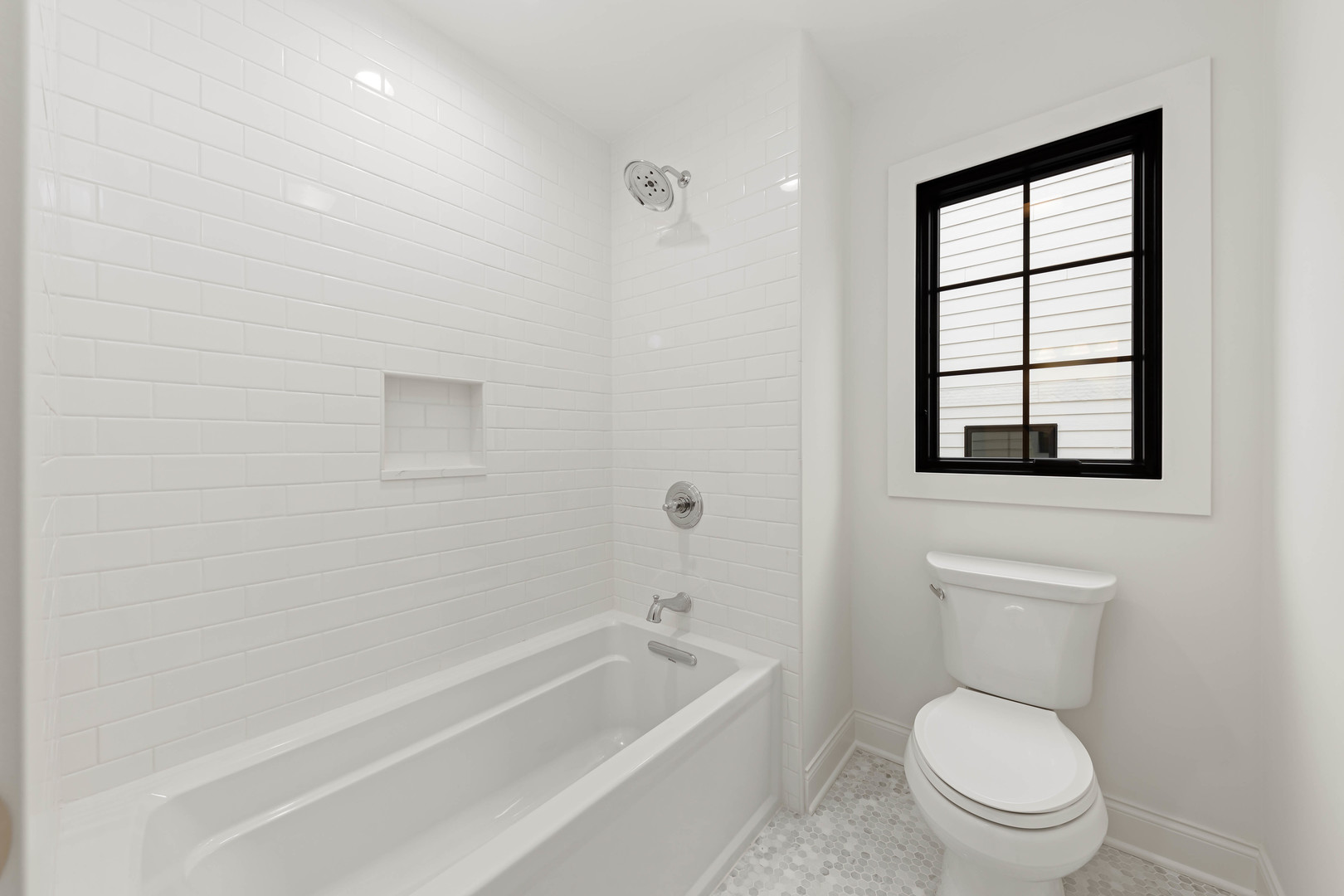 1310 Eagle Street Naperville, IL 60563 - Photo 31 of 38 a bathroom with a toilet a sink and bathtub