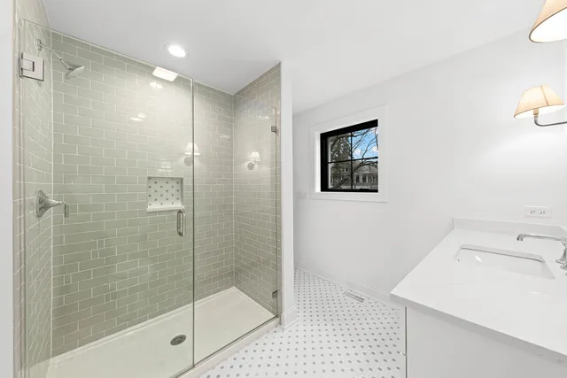 a picture of a bench in front of a building