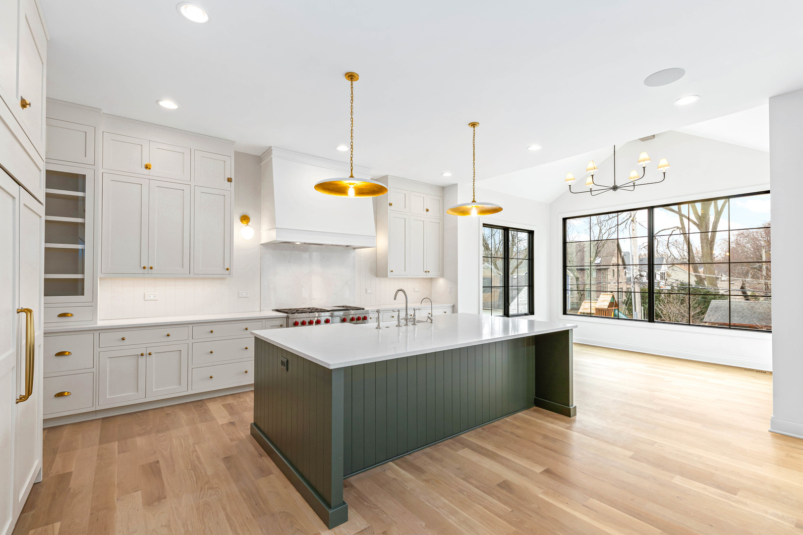 1310 Eagle Street Naperville, IL 60563 - Photo 8 of 38 a kitchen with stainless steel appliances a sink stove and wooden floor