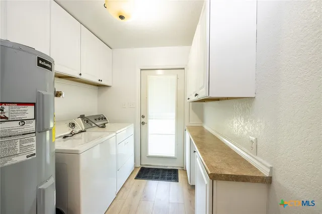 a kitchen with a sink stove and refrigerator