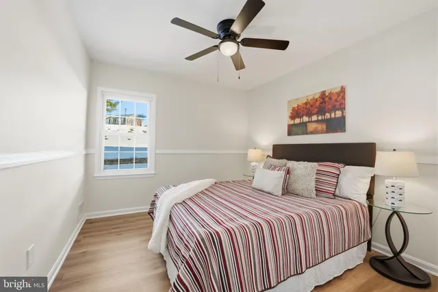 a bedroom with a large bed and a window