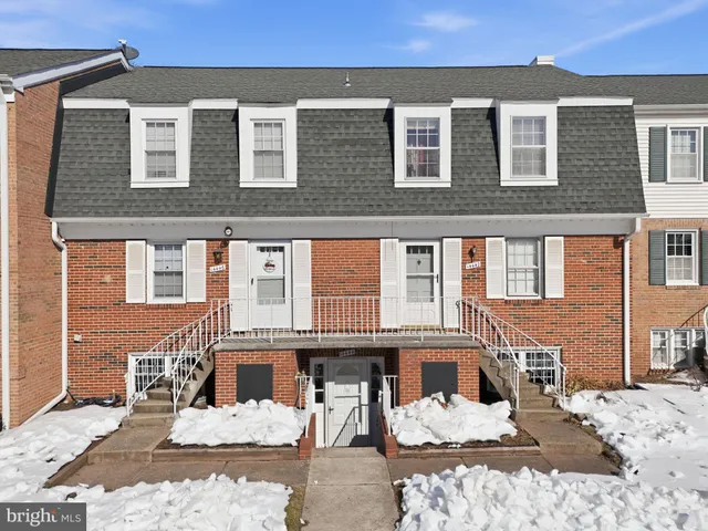 a front view of a house with a yard outdoor space