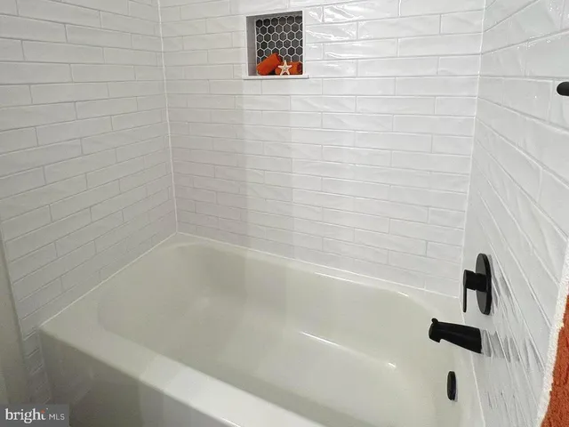 a close up of a bathtub curtain