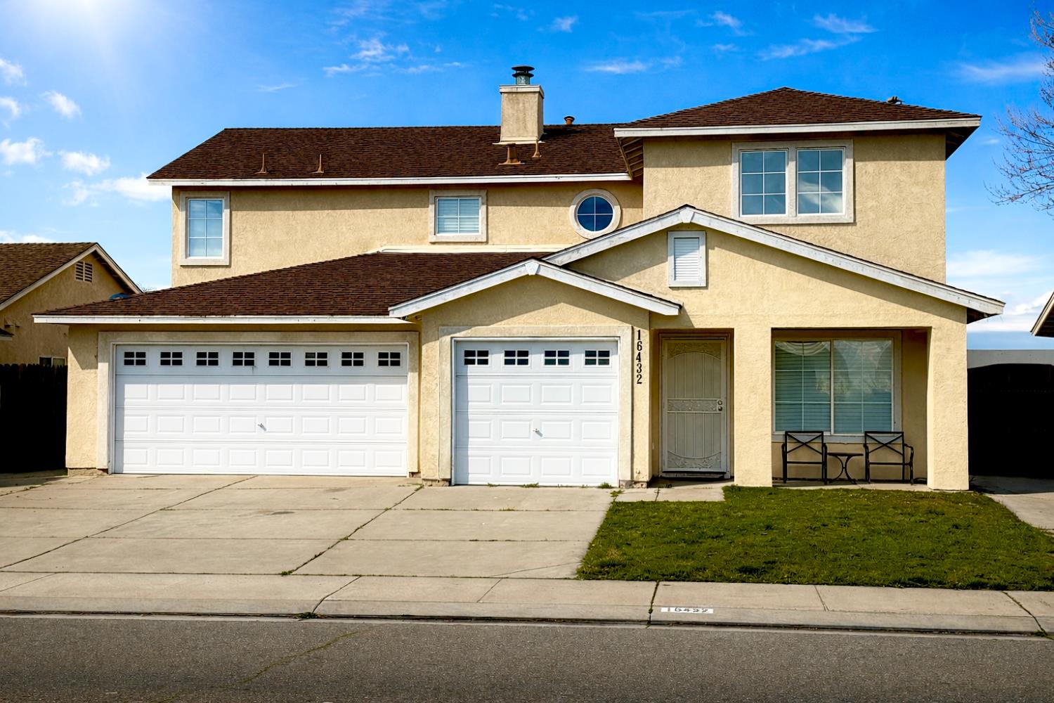 16432 Harmony Ranch Drive Delhi, CA 95315 - Photo 1 of 19 a front view of a house with a yard and garage