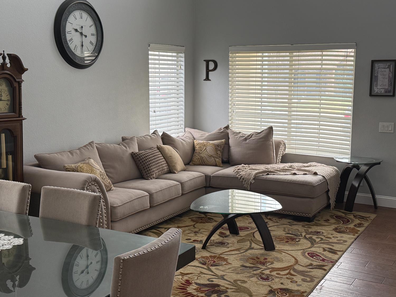 16432 Harmony Ranch Drive Delhi, CA 95315 - Photo 4 of 19 a living room with furniture a window and a clock