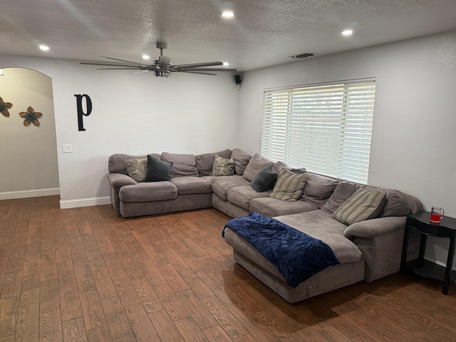 16432 Harmony Ranch Drive Delhi, CA 95315 - Photo 7 of 19 a living room with furniture and a large window