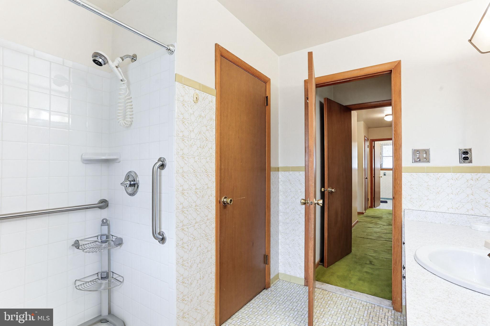 9301 Gardenia Road Baltimore, MD 21236 - Photo 24 of 37 a bathroom with a shower and a sink