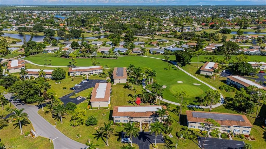 230 Albi Road, Unit 2494 Naples, FL 34112 - Photo 19 of 22 View of property location featuring a nearby body of water and nearby suburban area