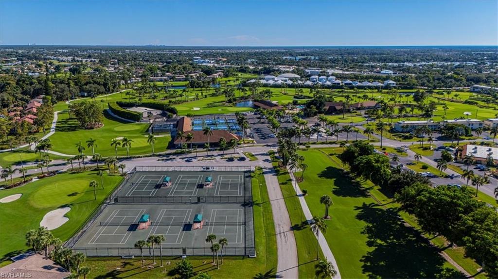 230 Albi Road, Unit 2494 Naples, FL 34112 - Photo 20 of 22 Aerial perspective of suburban area with a golf course