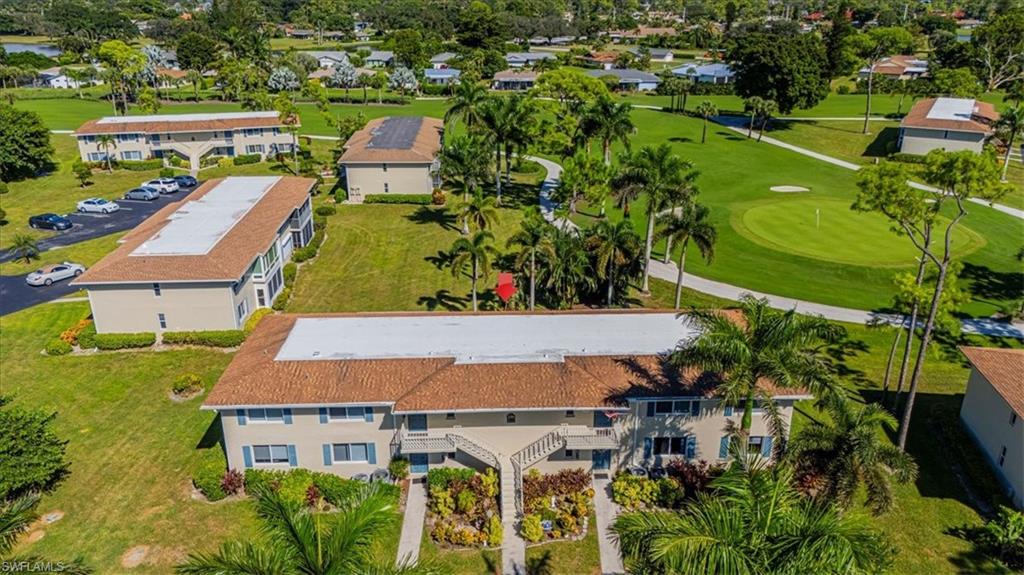 230 Albi Road, Unit 2494 Naples, FL 34112 - Photo 21 of 22 Drone / aerial view of a local golf course