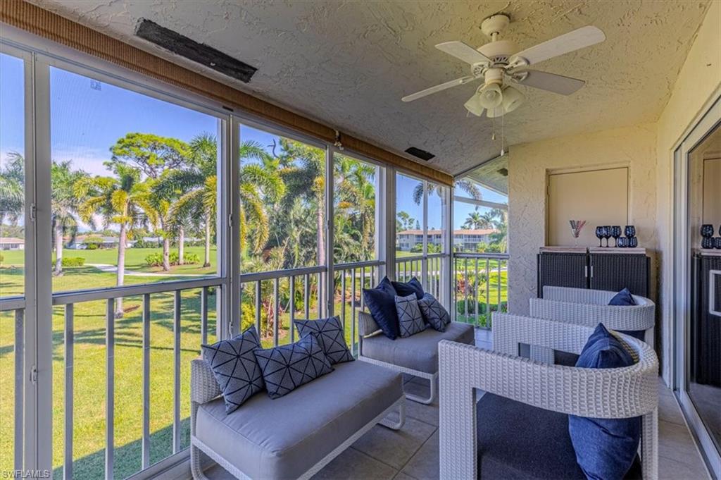 230 Albi Road, Unit 2494 Naples, FL 34112 - Photo 7 of 22 Sunroom / solarium with a ceiling fan, an outdoor living space, and a balcony
