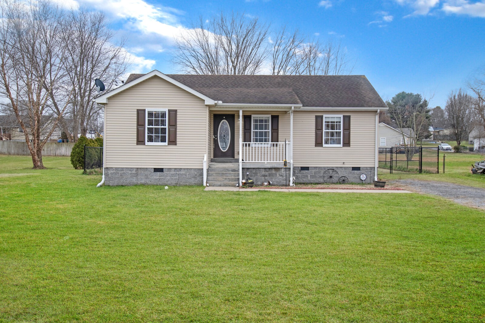 a front view of house with yard and outdoor seating